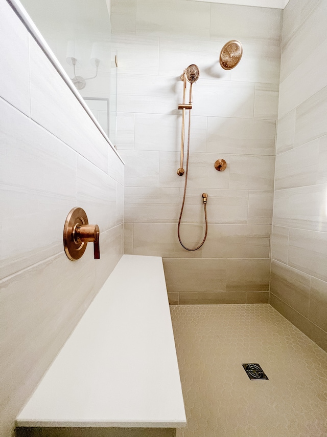 bathroom with tiled shower