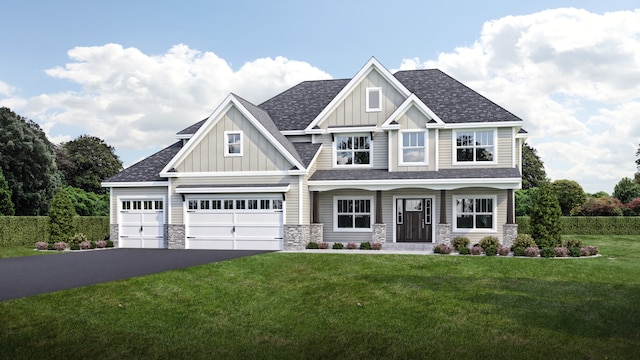 craftsman inspired home featuring a front yard and a garage