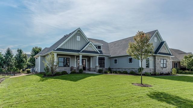 craftsman house with a front yard and central AC