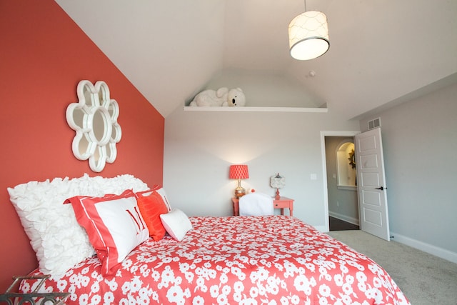 carpeted bedroom with vaulted ceiling