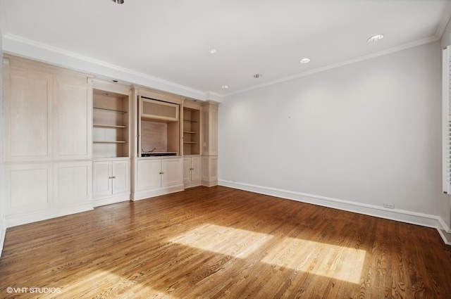 unfurnished room with crown molding and light wood-type flooring