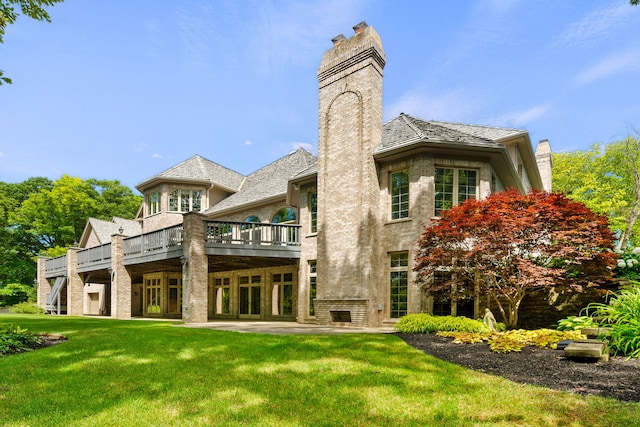 rear view of property featuring a yard