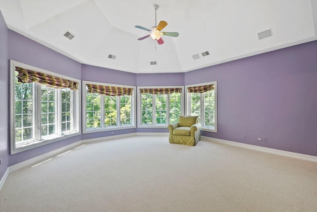 unfurnished room with ceiling fan, carpet floors, and plenty of natural light