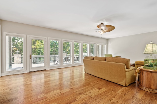 living room with ceiling fan, light hardwood / wood-style flooring, and plenty of natural light