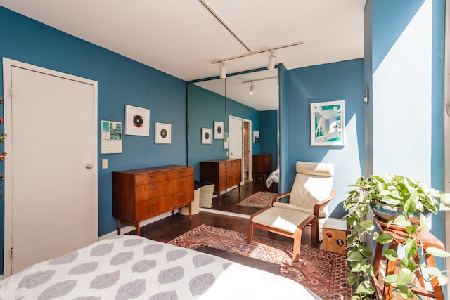 bedroom featuring track lighting