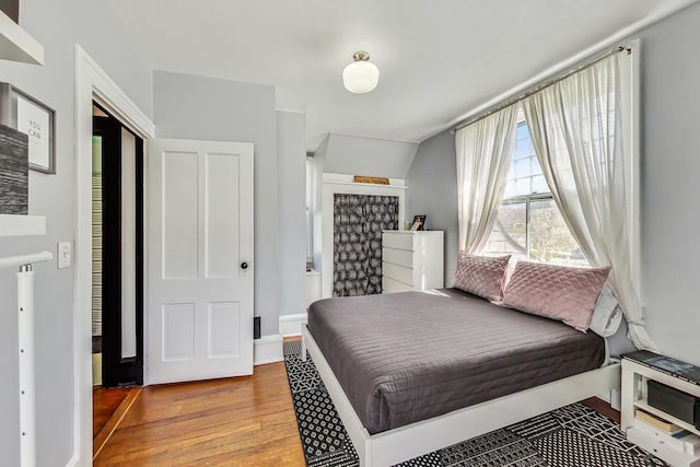 bedroom with light hardwood / wood-style flooring and a closet