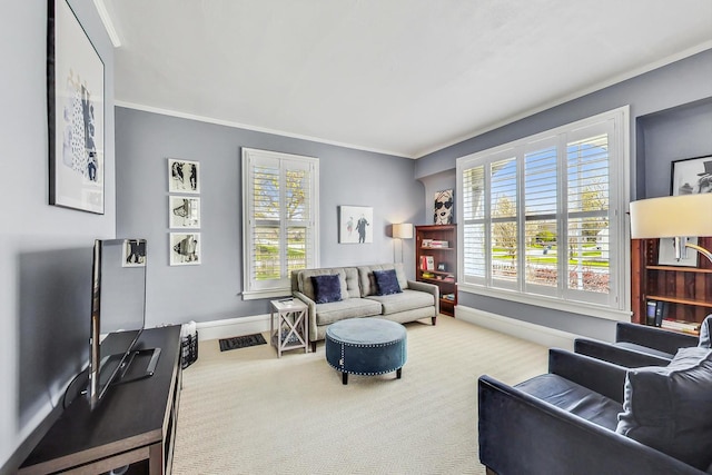 carpeted living room featuring ornamental molding