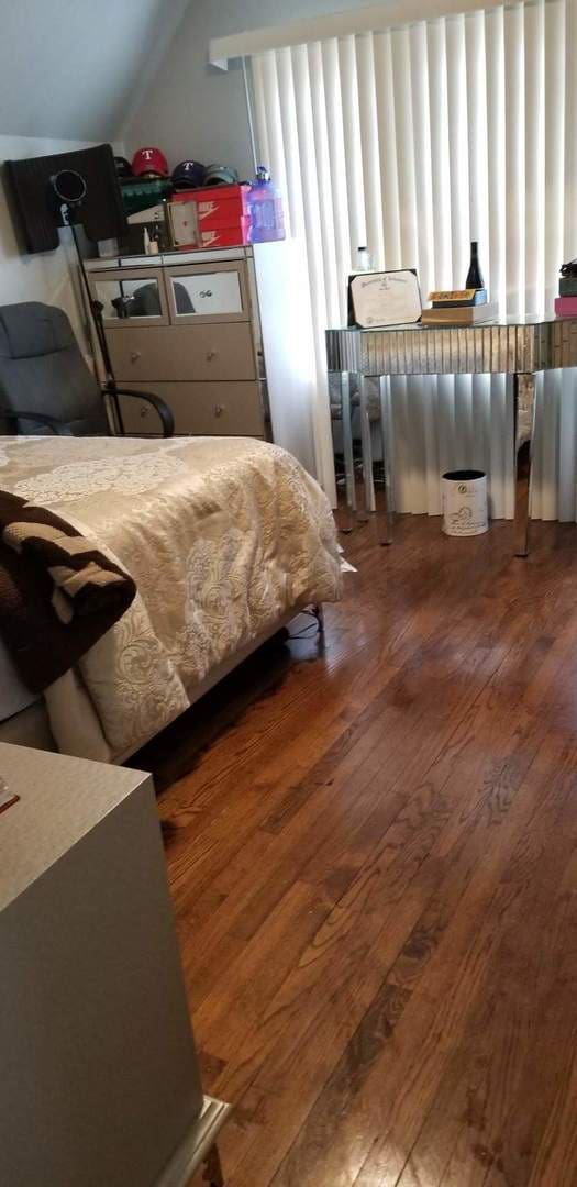 bedroom with wood-type flooring