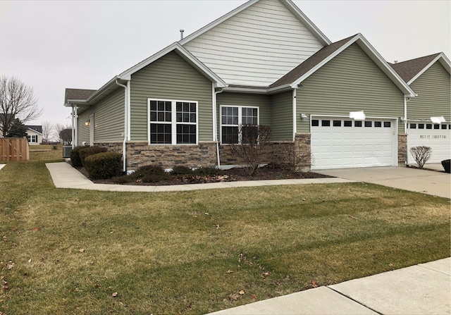 view of front facade with a front yard and a garage