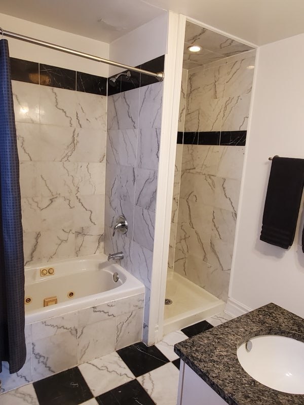 bathroom featuring tile floors and vanity