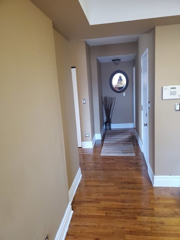 hallway featuring dark wood-type flooring