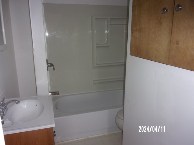 full bathroom with shower / washtub combination, toilet, tile floors, and vanity