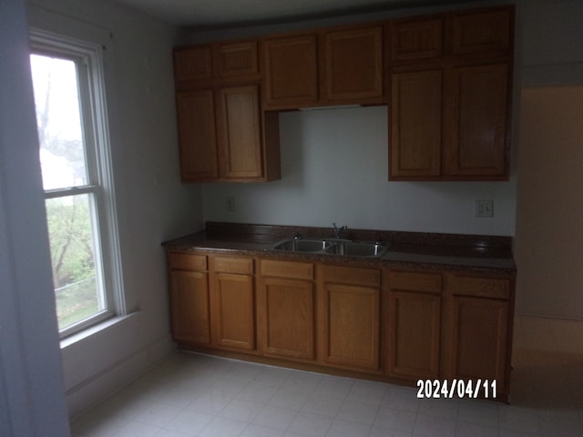 kitchen featuring sink and light tile floors