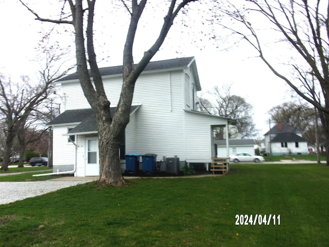 view of property exterior featuring a yard