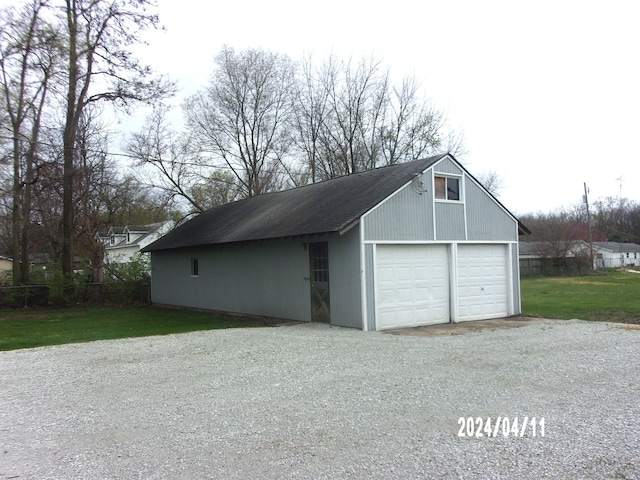 garage with a yard