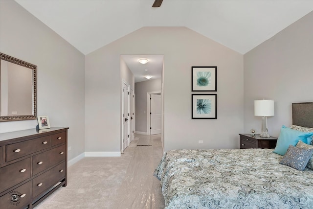 bedroom featuring ceiling fan, vaulted ceiling, and light carpet