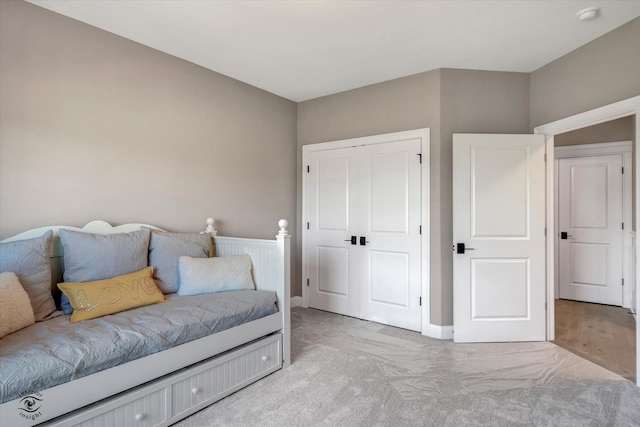 carpeted bedroom with a closet