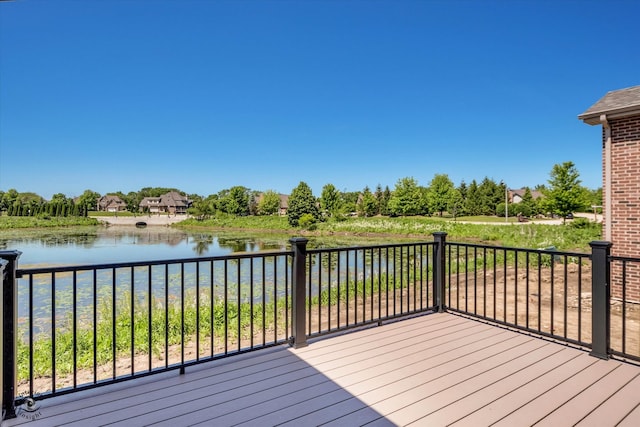 wooden deck featuring a water view