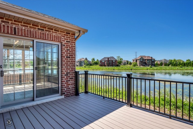 wooden deck featuring a water view