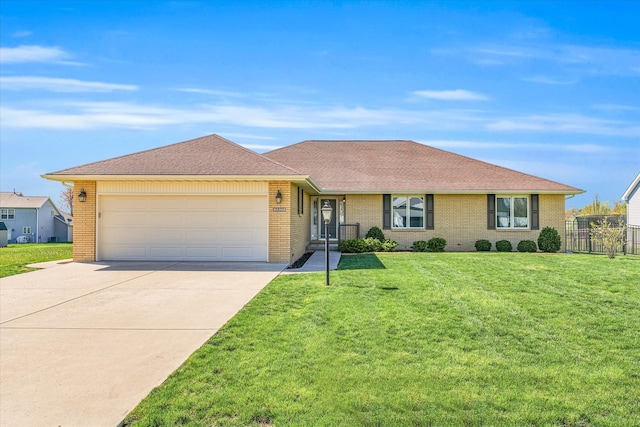 single story home with a front lawn and a garage