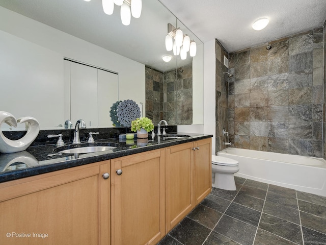 full bathroom with tile flooring, tiled shower / bath combo, dual vanity, a textured ceiling, and toilet