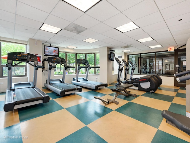 workout area featuring a drop ceiling