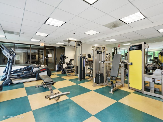 gym featuring a paneled ceiling