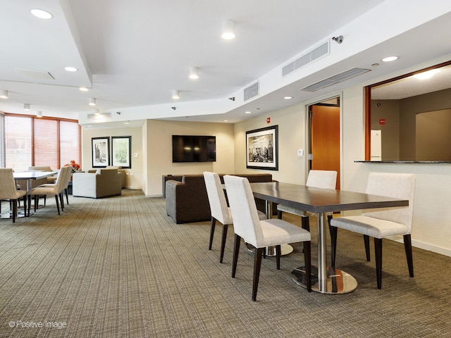 dining area with light colored carpet