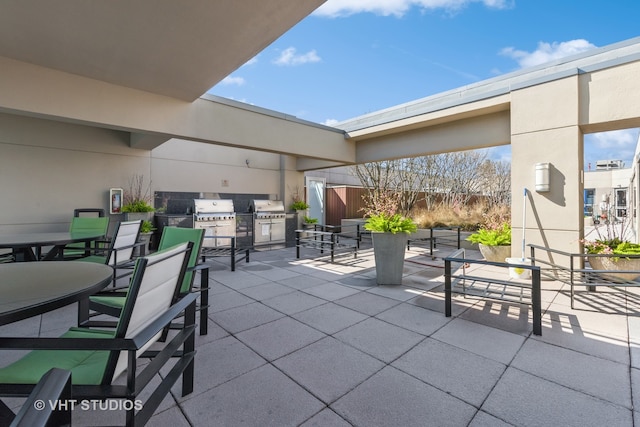 view of patio / terrace with an outdoor kitchen, a grill, and outdoor dining area