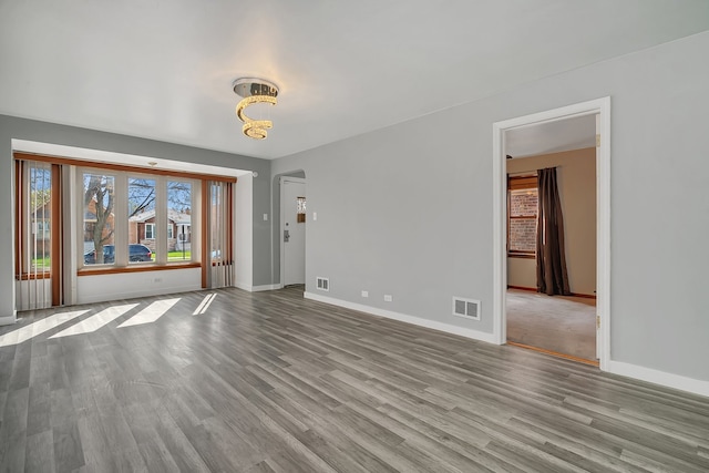 spare room featuring light hardwood / wood-style flooring