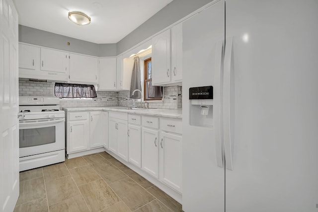 kitchen featuring light tile floors, sink, white appliances, backsplash, and white cabinetry