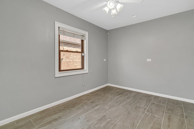 unfurnished room with ceiling fan