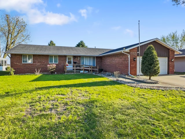 single story home featuring a garage and a front yard