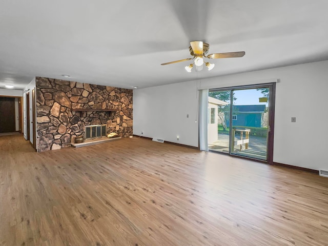 unfurnished living room featuring light hardwood / wood-style flooring, a fireplace, and ceiling fan