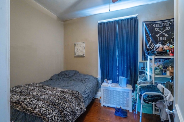 bedroom featuring dark hardwood / wood-style flooring