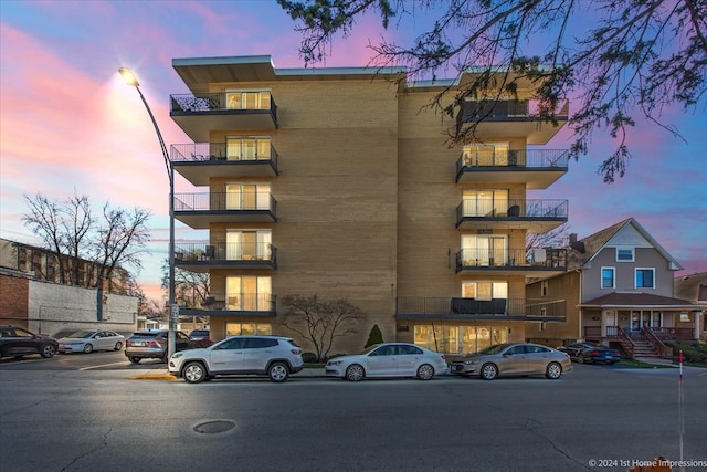 view of outdoor building at dusk