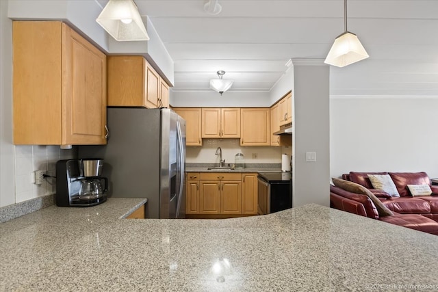 kitchen featuring decorative light fixtures, range with electric stovetop, tasteful backsplash, light brown cabinetry, and sink