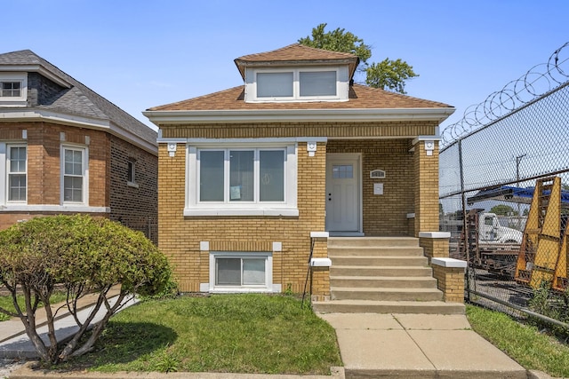 view of front facade featuring a front yard