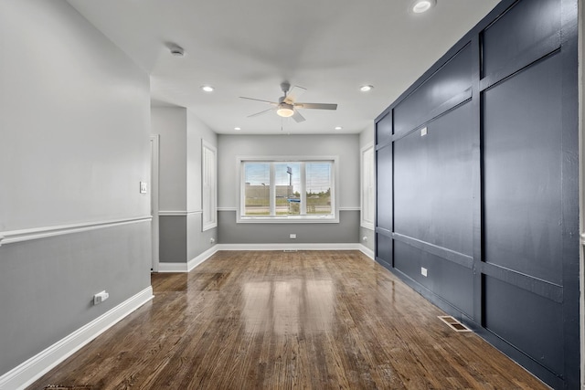 spare room featuring baseboards, visible vents, ceiling fan, wood finished floors, and recessed lighting