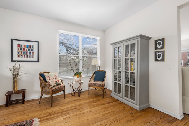 sitting room with light hardwood / wood-style flooring