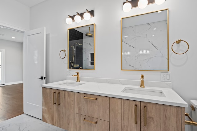 bathroom with tile flooring, toilet, and double sink vanity