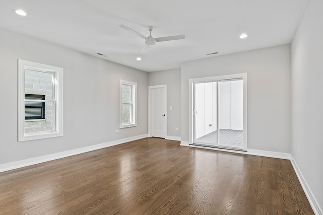 unfurnished room with dark wood-type flooring and ceiling fan