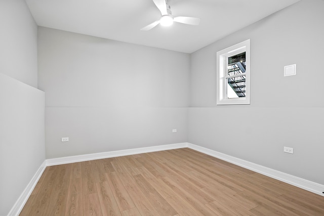 spare room with light hardwood / wood-style floors and ceiling fan