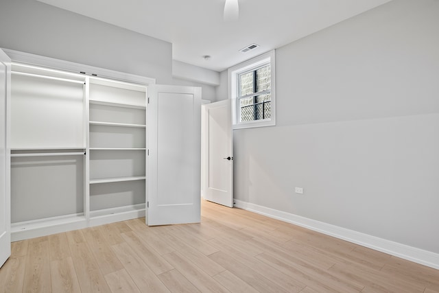 unfurnished bedroom featuring light hardwood / wood-style flooring and ceiling fan