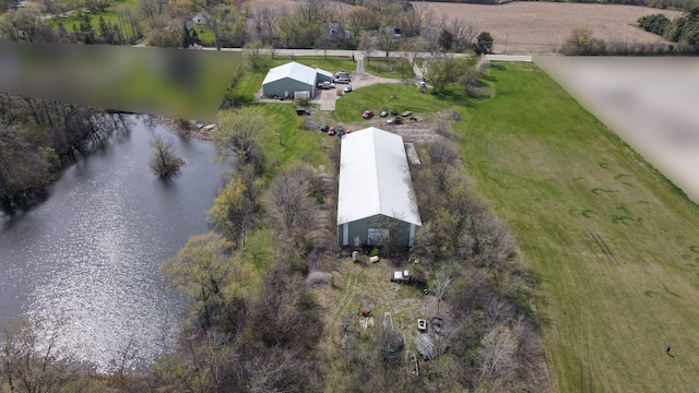 drone / aerial view featuring a water view and a rural view