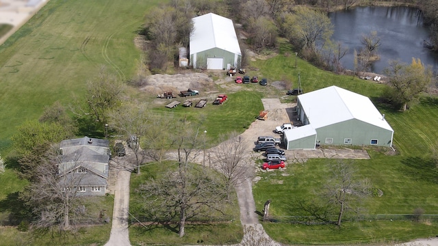 birds eye view of property with a water view and a rural view