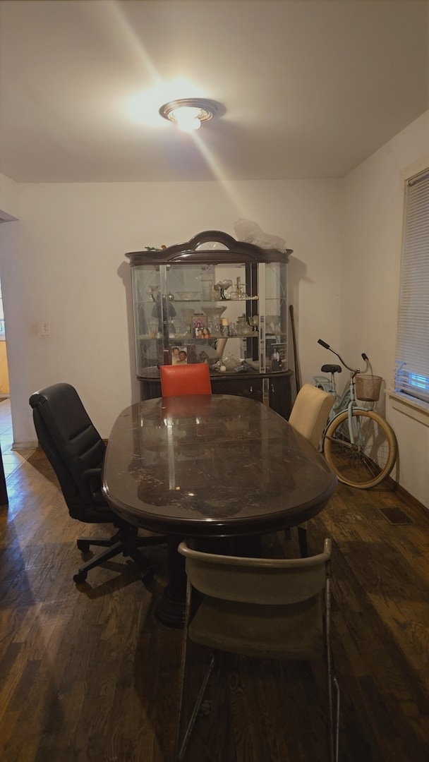 dining space featuring dark hardwood / wood-style floors