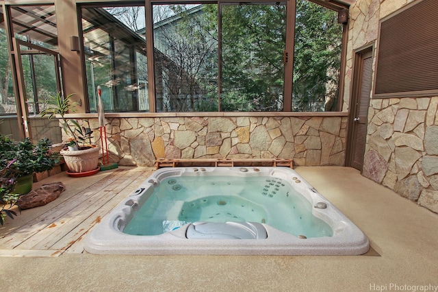 view of swimming pool featuring a wooden deck and an outdoor hot tub