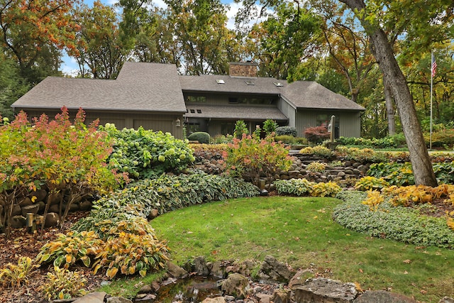 exterior space featuring a front lawn