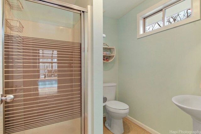 bathroom featuring sink and toilet